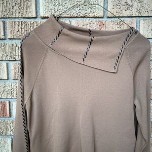 Tan off the shoulder sweater with braided detailing